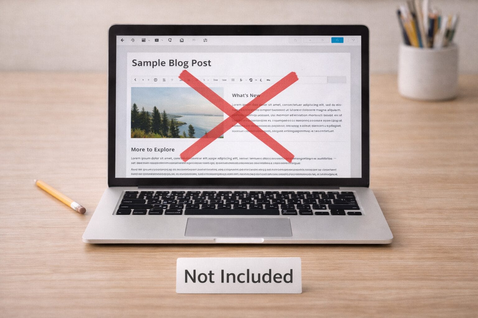 Laptop on a tidy desk showing a blog post editor on screen with a large X overlay and a “Not Included” label beneath it.